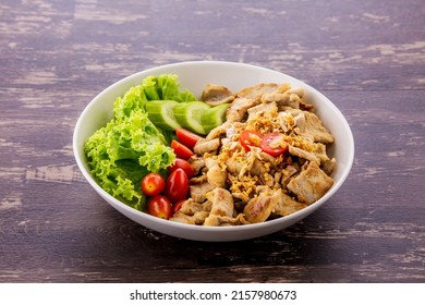 Garlic Fried Pork On Dark Wooden Background