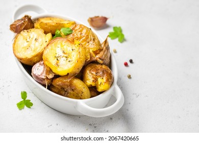 Garlic Herbed Roasted Smashed Baked Potatoes In Baking Dish. Copy Space.