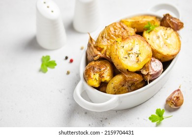 Garlic Herbed Roasted Smashed Baked Potatoes In Baking Dish. Copy Space.