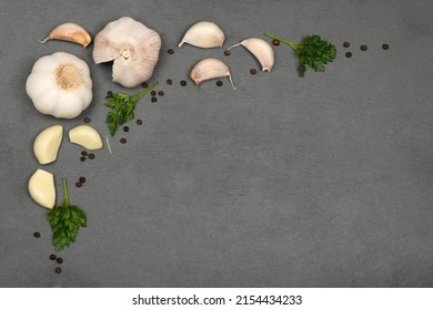Garlic isolated on black stone background. High resolution photo. Full depth of field. - Shutterstock ID 2154434233