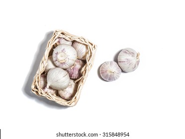 Garlic Isolated On White In A Basket Top View