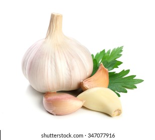 Garlic with leaves of parsley isolated on white - Shutterstock ID 347077916