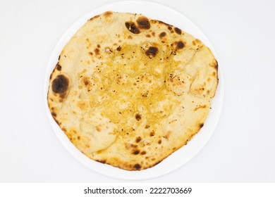 Garlic Naan Bread On A White Plate