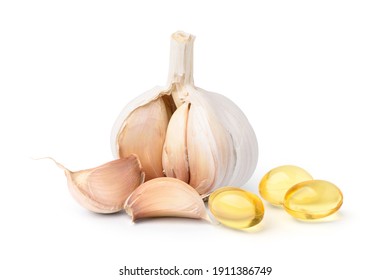 Garlic oil capsules with garlic cloves and bulb isolated on white background. - Powered by Shutterstock