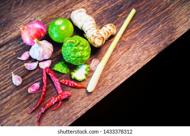 Garlic, Onion, Chili, Lemon, Bergamot, Lemongrass On Wood Background, Cooking Concept