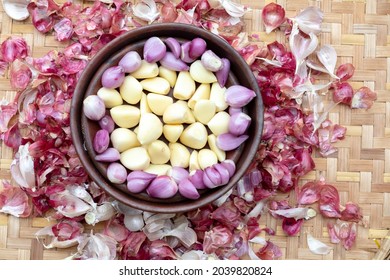garlic and onion, surrounded by leftover peeled skins