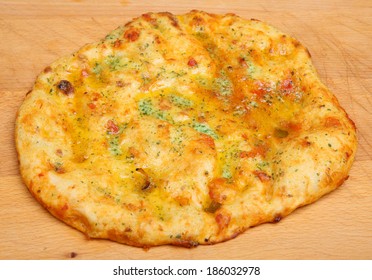 Garlic Pizza Bread On Wooden Chopping Board