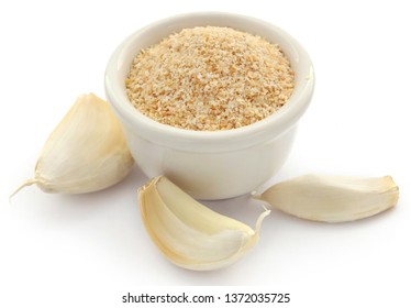 Garlic powder with garlics over white background - Powered by Shutterstock