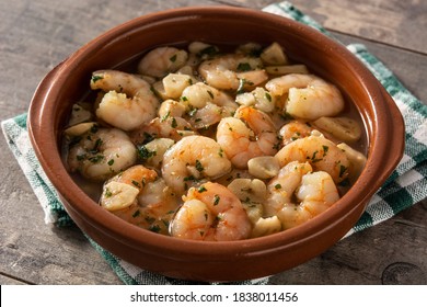 Garlic Prawns In Crockpot On Wooden Table