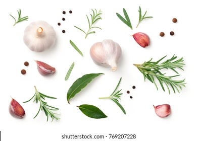 Garlic, rosemary, bay leaves, allspice and pepper isolated on white background. Flat lay. Top view 