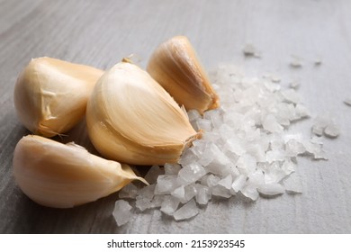 Garlic Salt Concept. Garlic Cloves And Salt Granules. Garlic Salt Is A Widely Used Flavour Combination When Cooking