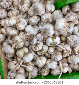 Garlic is the spice of choice for Indonesian people and is sold in various places, from traditional markets to modern markets (malls). - Shutterstock ID 2365363801