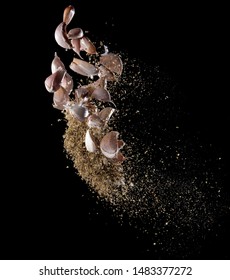 Garlic,various Spices, Pepper And Salt Splash Or Explosion Flying In The Air Isolated On Black,Stop Motion