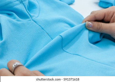 at a garment factory quality control check for defects - Powered by Shutterstock