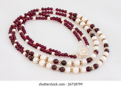 Garnet And Pearl Necklace Over White