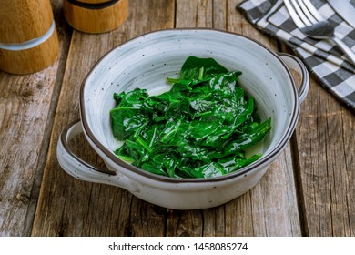 Garnish Steamed Spinach On Wooden Table