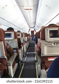 Garuda Flight, Indonesia - May 2022: In Flight Cabin, Passenger Sitting On Boeing 737 Airplane. Garuda Indonesia Airline.