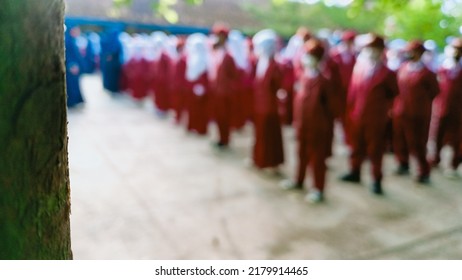 Garut, Indonesia - July 18, 2022 : Photo Blur Background Islamic Integrated Elementary School Students Line Up For The Morning Apple Ceremony For The Indonesian Flag Ceremony On Monday At Their School