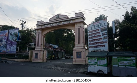 Garut, Indonesia - July 19th 2022 : The View Of The Gates Of The Garut University Campus, The Afternoon Atmosphere, It Can Be Seen Vehicles Going Back And Forth And Street Vendors' Carts And Billboard