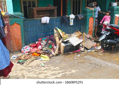 Garut, West Java, Indonesia - September 28, 2016. Scene In The Town Of Garut A Few Days After A Flash Flood Wiped Out Many Houses. A Pile Of Muddy Clothes Outside A House.
