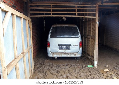 Garut, West Java, Indonesia - September 28, 2016. Scene In The Town Of Garut A Few Days After A Flash Flood Destroyed Many Houses. A Vehicle Parked During The Flooding.