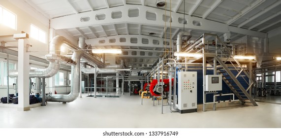 Gas Boiler, Control Cabinet And Pipes For The Supply Of Gas And Steam. Panoramic View Of Boiler Room