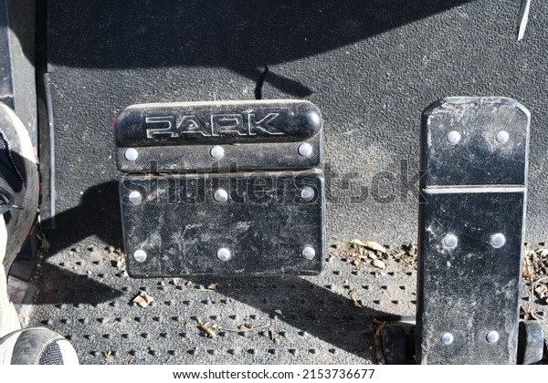 Gas and brake pedals on a\
golf cart