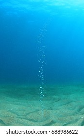 Gas Bubbles Rise Through Ocean Floor