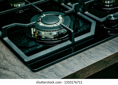 Gas Burner In Modern Kitchen Stove Cook At Home. Domestic Gas Stove Black Burner On Gray Stone Kitchen Countertop. Detail Of Gas Cooker Propane Natural Gas Burner Ring At Restaurant Kitchen Stovetop