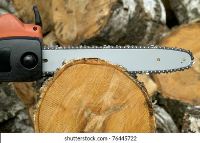 Gas Chain Saw Is Cut To Log Of Wood