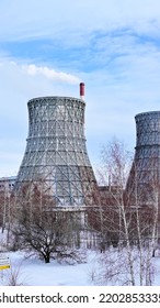 Gas Combined Heat And Power Plant With Huge Pipes, Smoke, Steam, Power Stations On A Frosty Winter Day. The Use Of Natural Gas In The Heat And Power Industry. The Vertical Video. Blue, Cloudy Sky.