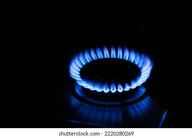 Gas Cooktop With Burning Flame In Darkness