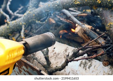 The Gas Cylinder Ignites The Branches In The Grill.