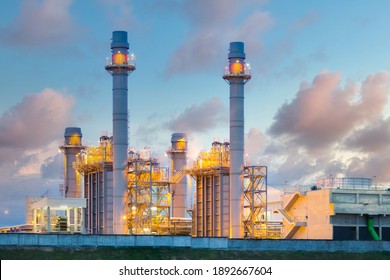 Gas Fired Power Plant And Factory Building At Night. Also Called Gas Fired Power Station Or Natural Gas Power Plant. That Technology To Burn Natural Gas And Generate Electricity Or Electrical Energy.