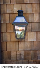 Gas Flame Porch Light On A Cedar Shake Wall. Cedar Shake. Cedar Shake Background. Wood Shake Wall. Backgrounds And Wallpapers. Room For Text.
