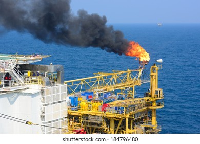 The gas flare is on the offshore oil rig platform