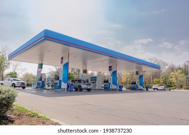 Gas fuel station with clouds sky and sun light