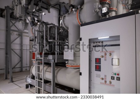 A gas insulated switchgear(GIS) in control building for extra high voltage electrical power substation. Sulfur hexafluoride used in the electrical industry as a gaseous dielectric.