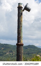 A Gas Lamp Post With A Broken Lamp