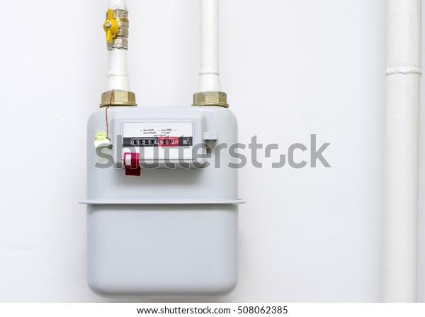 A gas meter in the private house, counter for\
distribution domestic gas. 