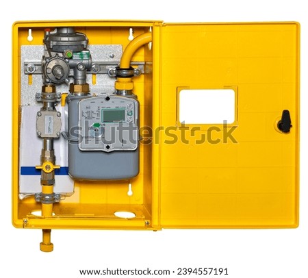 Gas metering unit in a bright yellow metal box, distribution gas meter. Isolated on a white background.