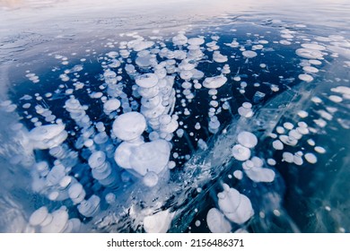 Gas Methane Bubbles Frozen In Winter Ice Of Lake Baikal, Abstract Background.