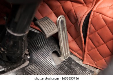 Gas Pedals And Brakes In A Truck On The Floor With A Rubber Mat. The Concept Of Developing And Accelerating A Business Or Its Braking By Management.