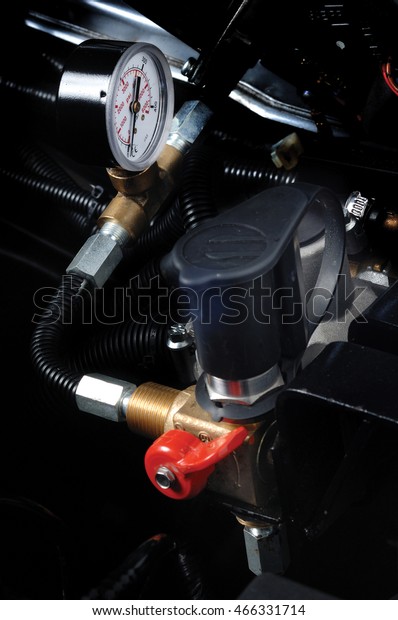 Gas pipeline and\
meter in car engine.\
