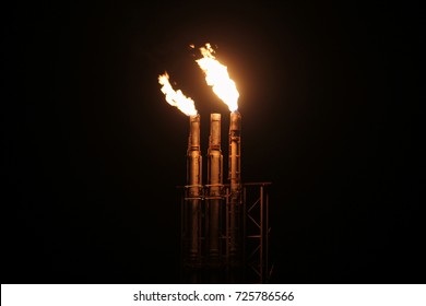 Gas Plant Flare Stack Burning At Night, Western Australia