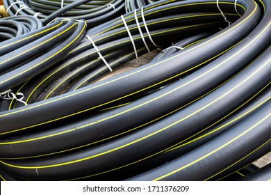 Gas Polypropylene Pipe In Rolls On The Street, Black Plastic Pipes