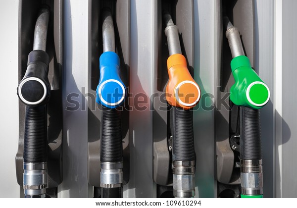 Gas pump nozzles in a\
service station