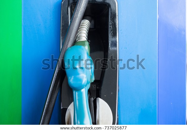 Gas pump nozzles in a
service station