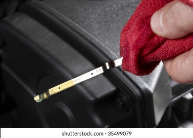 Gas Station Attendant, Holding Red Rag, Checks Oil Level