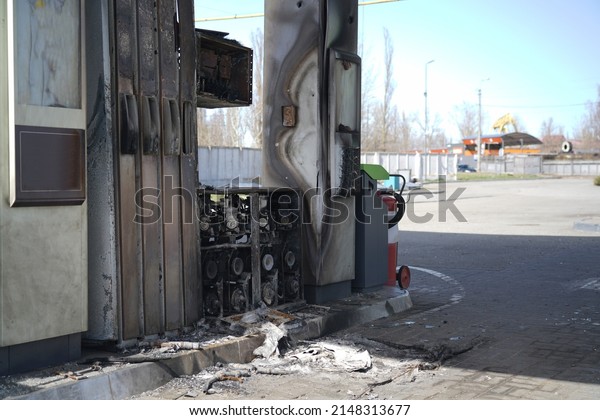 Gas station with a broken station\
from a shell explosion. Exploded gas station during the\
war.